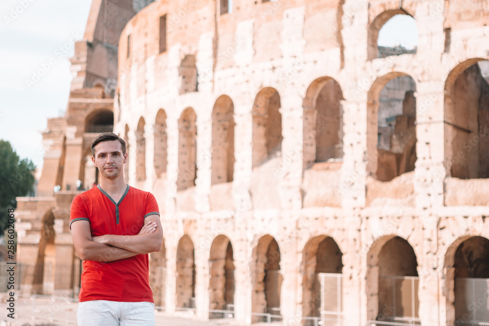 Young hipster man in front of Colosseum
