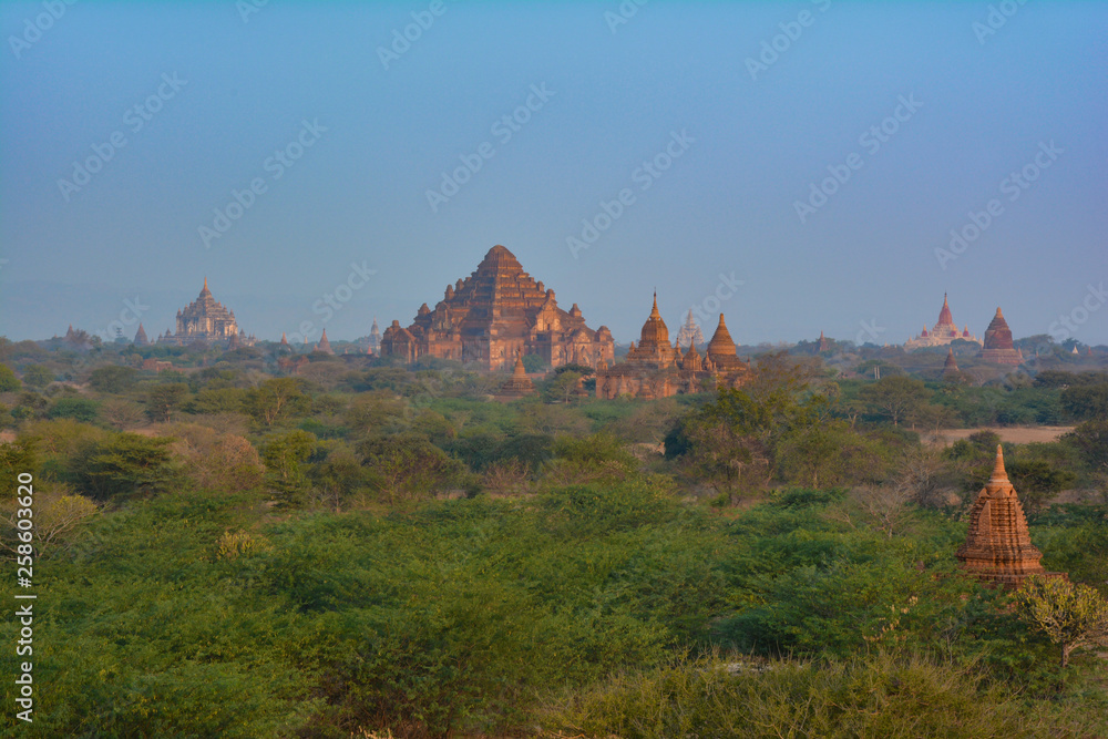 Beautiful Dhammayan Gyi Temple with Ananda and Thatbyinnyu Temples on the background. Bagan, Myanmar Beautiful Dhammayan Gyi Temple with Ananda and Thatbyinnyu Temples on the background. Bagan, Myanmar