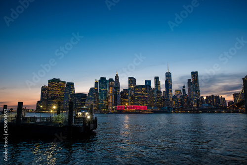 View of the Brooklyn bridge during a dusk from East river. New York City © DOUGLAS