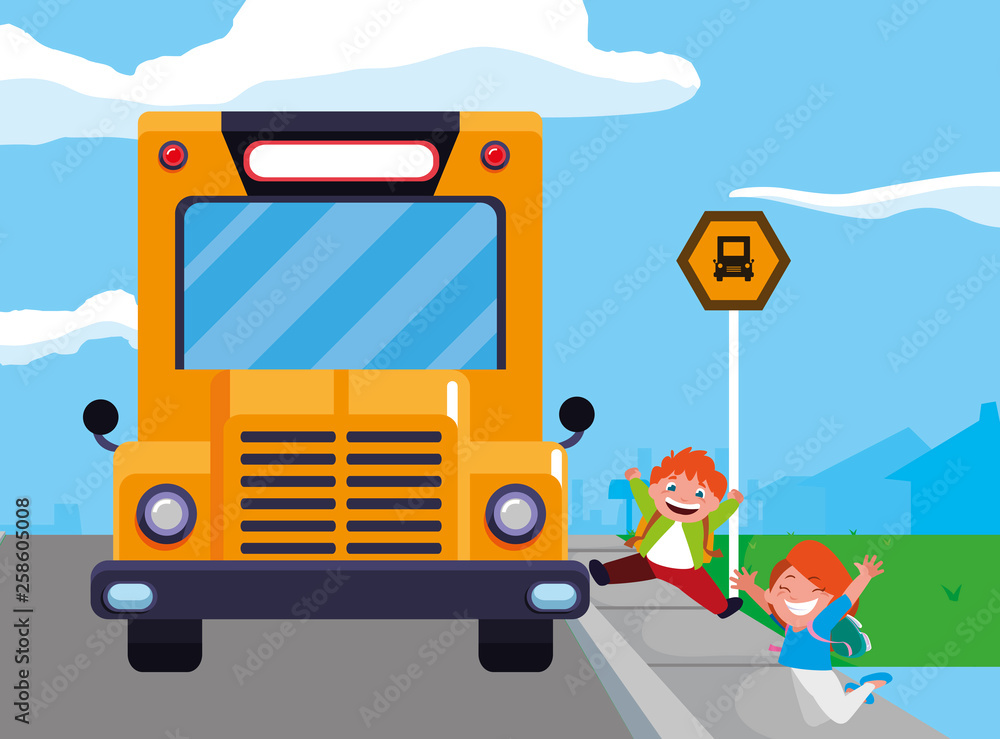 happy little school kids in the bus stop