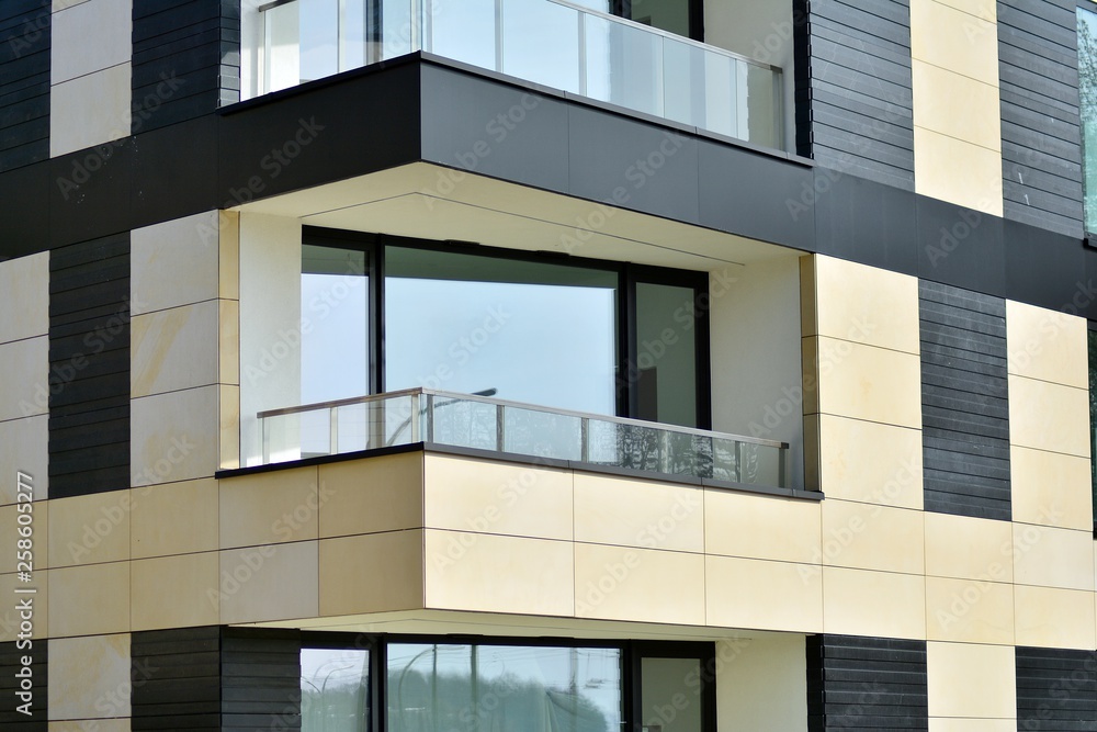 Fragment of a modern apartment building in front. Very modern apartment house. Fragment of a modern apartment building in front. Very modern apartment house.