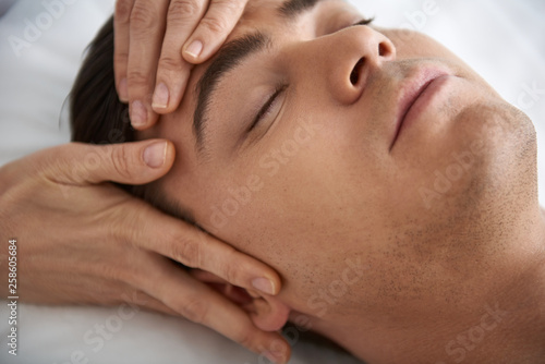 Close up of lifting face massage for young man
