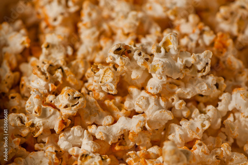 Closeup of popcorn covered in hot sauce