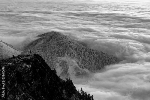 Niubeishan Landscape, Cattle Back Mountain, Sichuan Province China. Snow mountains, Ice Frost and Rime. Frozen Winter Landscape, Frigid Cold Atmosphere. Sea of Clouds photo