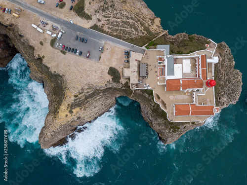 Aerial drone panoramic view of the lighthouse and cliffs at Cape St. Vincent at sunset. Algarve seascape.  Amazing landscape.Continental Europe's most South-western point, Sagres, Portugal.