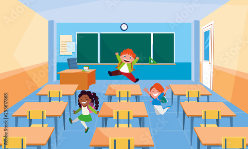 happy little interracial school kids in the classroom