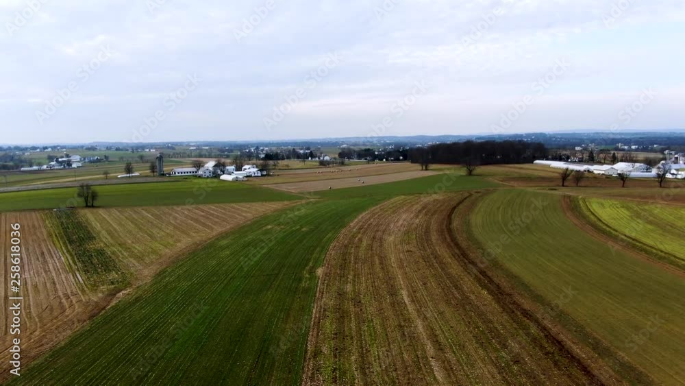 Aerial short pull back to reveal farms dotting the fallow fields of Amish Country Lancaster County, Pennsylvania. Concept: Amish,farms,fall,autumn Aerial short pull back to reveal farms dotting the fallow fields of Amish Country Lancaster County, Pennsylvania. Concept: Amish,farms,fall,autumn