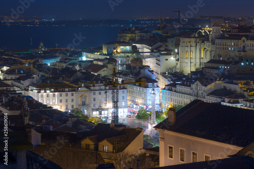 A beautiful night long exposure aerial cityscape. View of historic central quarters, Rossio Square, Convento do Carmo, elevador de Santa Justa in evening illumination, Lisbon, Portugal.