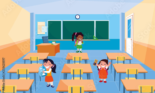 happy little school interracial girls in the classroom