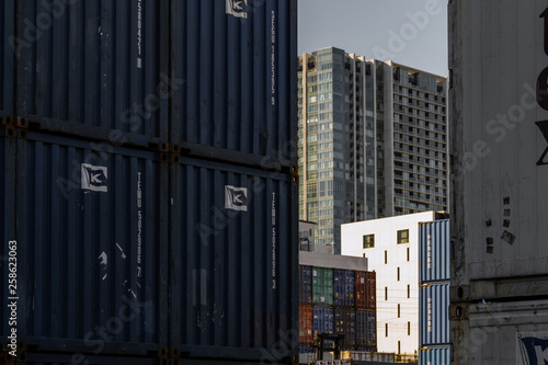 It is a group of containers lined with the blue sky and the port