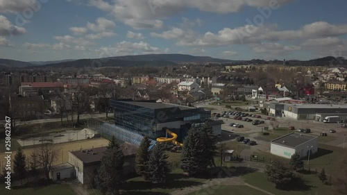 Gorlice, Poland - 3 9 2019: Panorama of the historic center of the European medieval city on the picturesque green hills. Trips to architectural monuments, temples, quarters and sports complex MOSiR photo