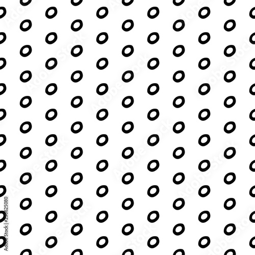 Abstract polka dot pattern with hand drawn dots. Cute vector black and white polka dot pattern. Seamless monochrome polka dot pattern for fabric, wallpapers, wrapping paper, cards and web backgrounds. © penarulit