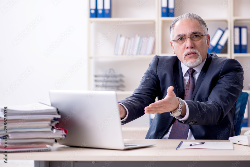 White bearded old businessman employee unhappy with excessive wo