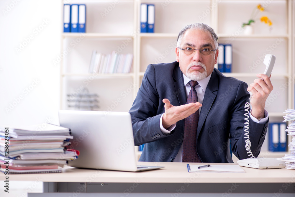 White bearded old businessman employee unhappy with excessive wo White bearded old businessman employee unhappy with excessive wo