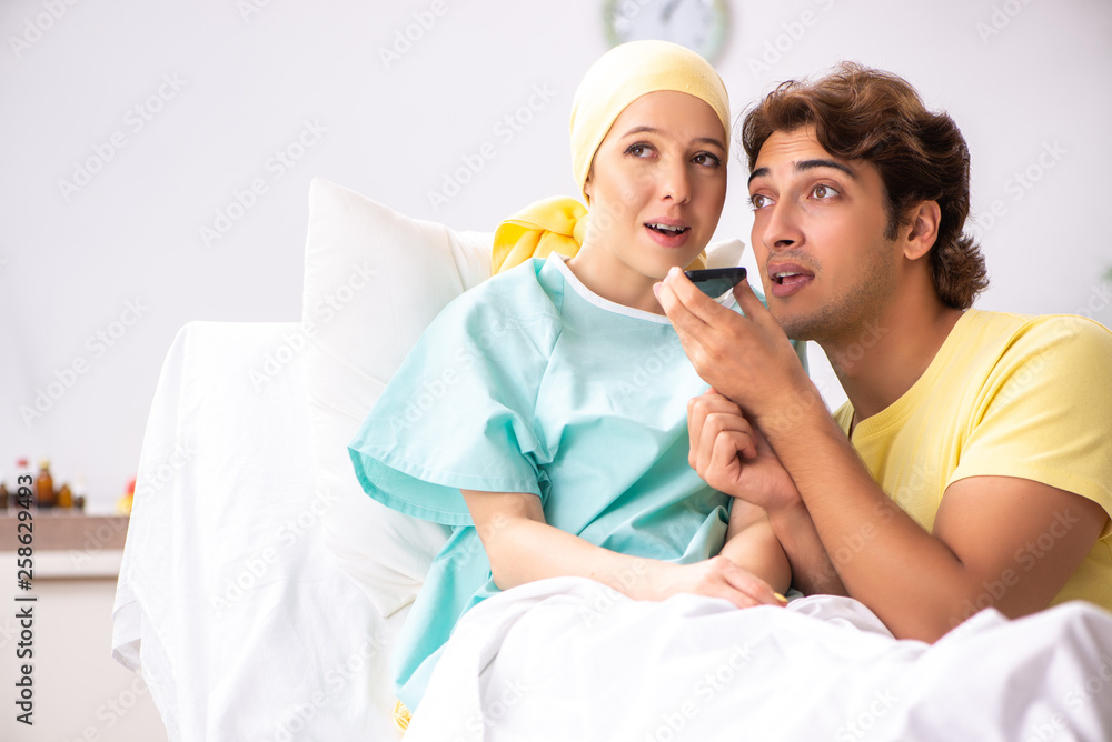 Husband looking after wife in hospital Husband looking after wife in hospital