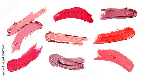 Set of different lipstick swatches on white background, top view