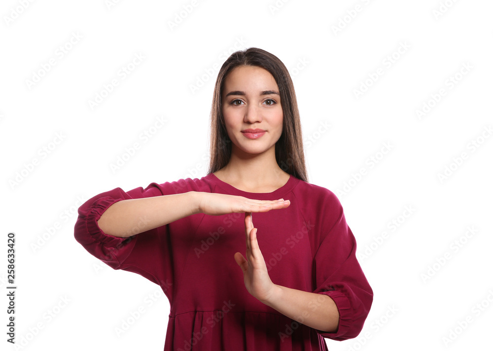 Woman showing TIME OUT gesture in sign language on white background Woman showing TIME OUT gesture in sign language on white background