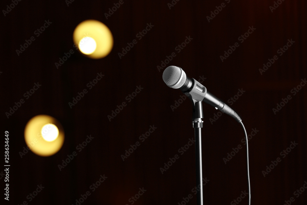 Obraz premium Microphone against festive lights, space for text