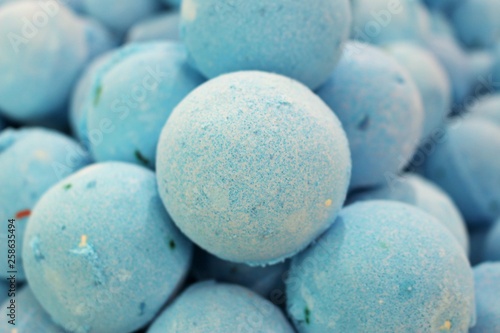 Close up photo of a stack of large, blue bath bombs at a wellness spa