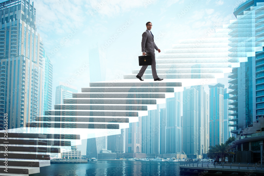 Businessman climbing career ladder over city Businessman climbing career ladder over city
