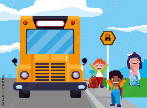 happy little interracial school kids in the bus stop © djvstock