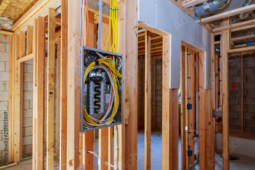 Interior wood framing of house under construction power supply for the house
