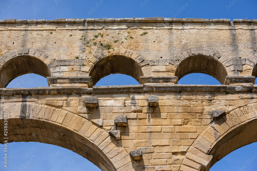 The magnificent three tiered Pont Du Gard aqueduct was constructed by Roman engineers in the 1st century AD in the south of France The magnificent three tiered Pont Du Gard aqueduct was constructed by Roman engineers in the 1st century AD in the south of France