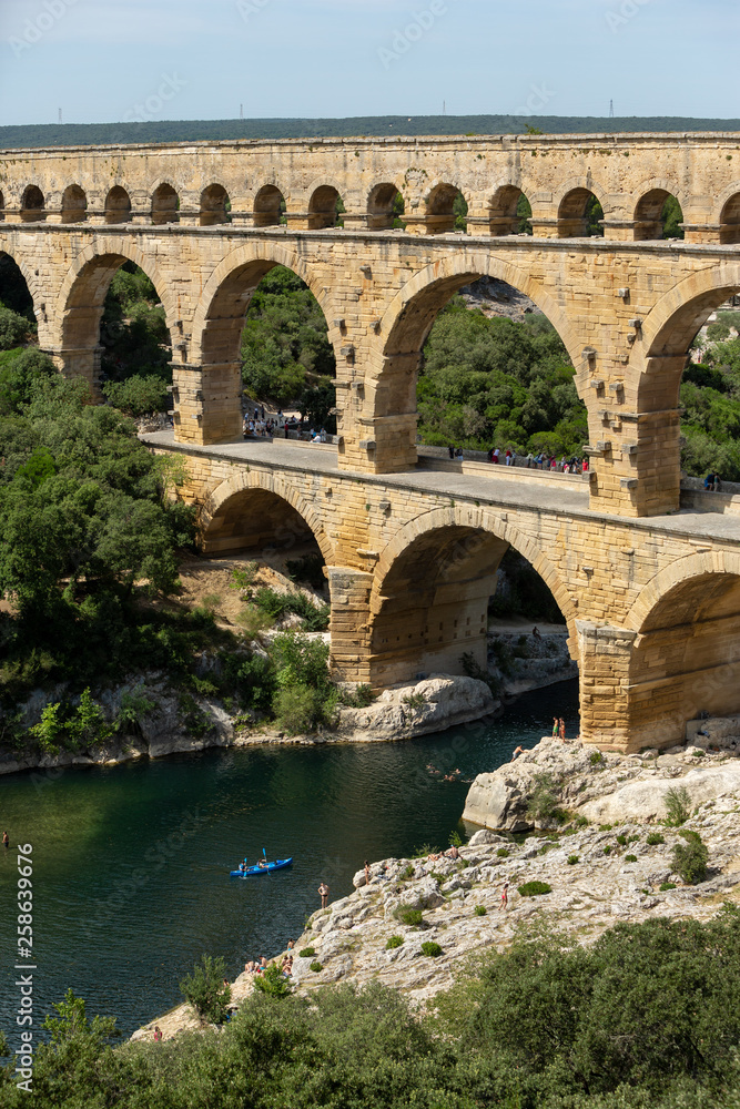 Gard, France July 13th 2015 : The magnificent three tiered Pont Du Gard aqueduct was constructed by Roman engineers in the 1st century AD in the south of France
