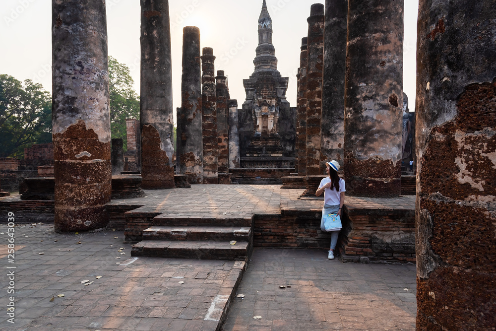 Asian tourists is visiting at Sukhothai in Thailand.Concept Travel