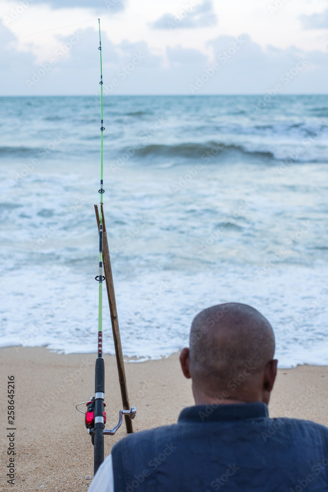 Senior man fishing at open sea. Thai people lifestyle. Senior man fishing at open sea. Thai people lifestyle.