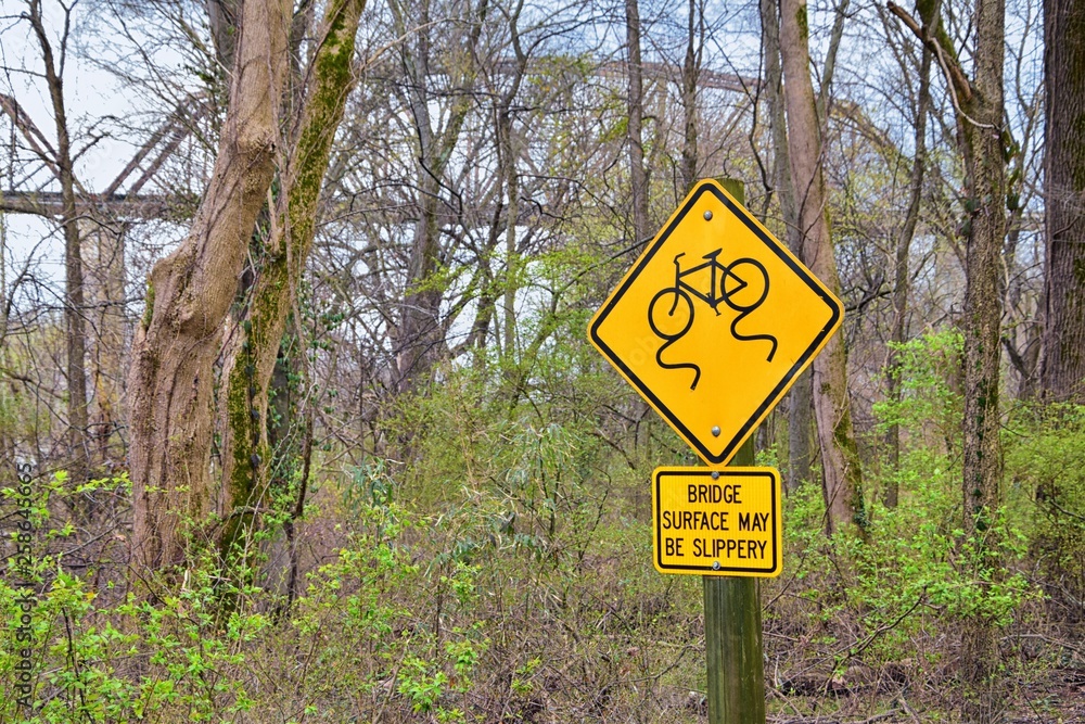 Trail and warning signs along the Shelby Bottoms Greenway and Natural Area Cumberland River frontage trails, Music City Nashville, Tennessee. United States.