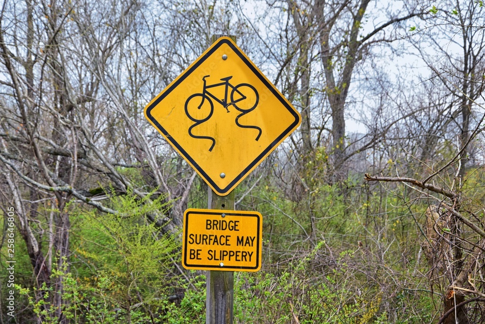 Trail and warning signs along the Shelby Bottoms Greenway and Natural Area Cumberland River frontage trails, Music City Nashville, Tennessee. United States.