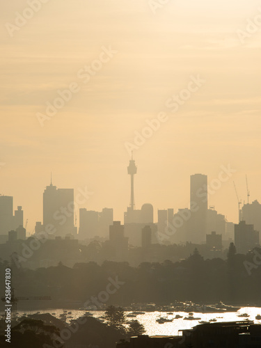 Photography Sydney skyline silhouette under the hazy summer sunlight.