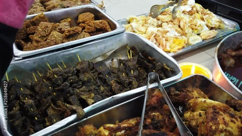 'Nasi lemak' (Malay fragrant rice) served with other dishes photo