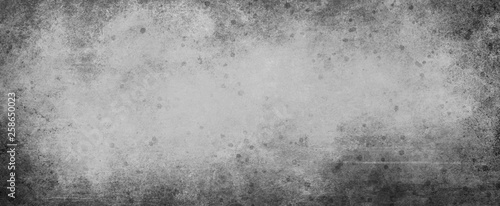 Damaged old grunge black and white background illustration with distressed paint spatter and grungy messy black border