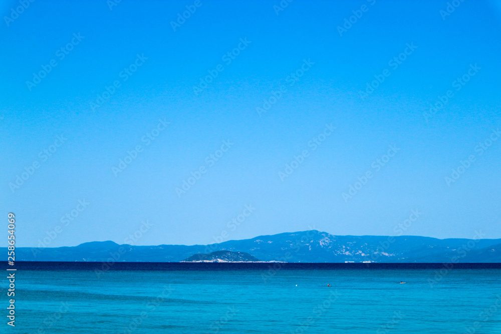 Azure mediterranean sea and bright blue sky, Greece