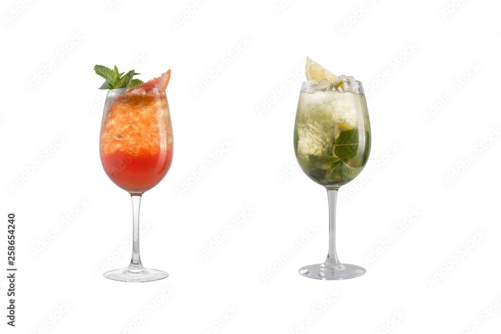 Alcohol cocktail with mint, fruit and berries on a white background. A set of two cocktails in glass goblets on a long leg.