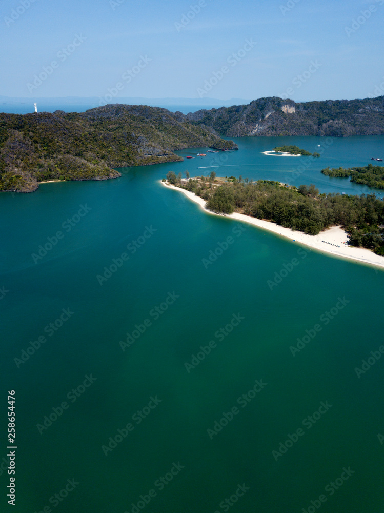 Obraz premium Aerial view of Kilim Geoforest Park. There is sea, river, coastline, mangroves and mountains on the photo. Langkawi, Malaysia.