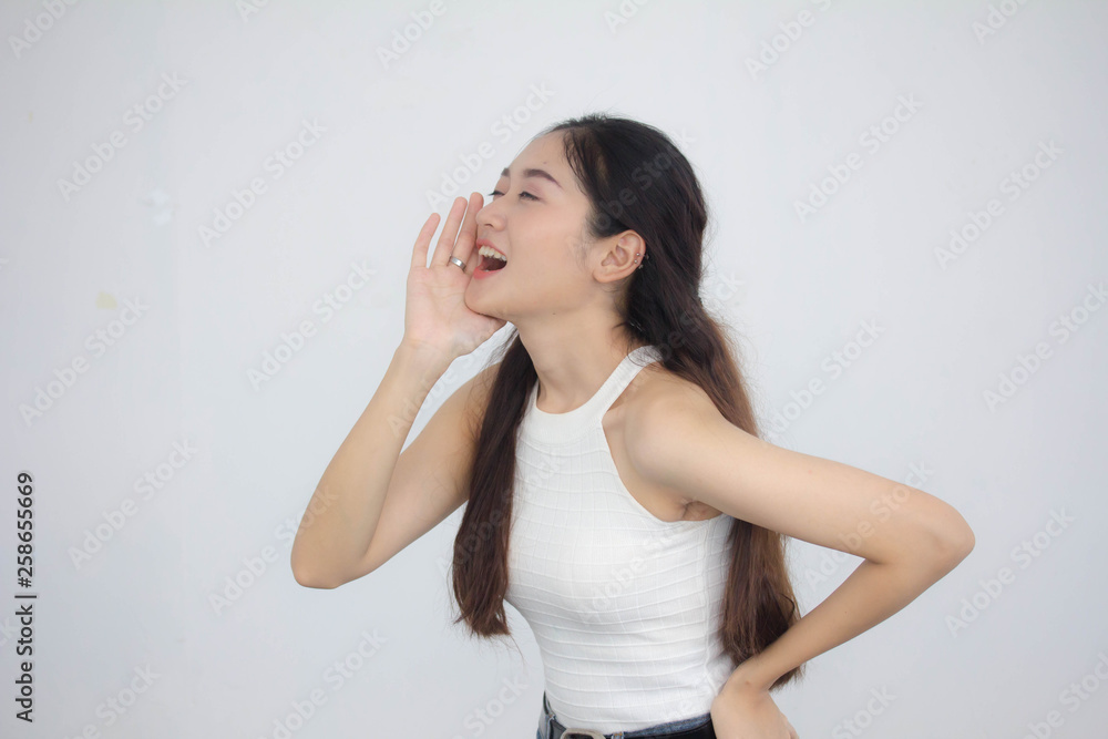 Portrait of thai china adult beautiful girl White shirt blue jeans Shout Portrait of thai china adult beautiful girl White shirt blue jeans Shout