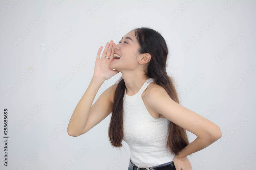 Portrait of thai china adult beautiful girl White shirt blue jeans Shout Portrait of thai china adult beautiful girl White shirt blue jeans Shout