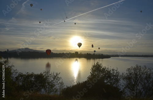 Canberra  Australia - March 10  2019. Hot air balloons flying in the air above Lake Burley Griffin  as part of the Balloon Spectacular Festival in Canberra.