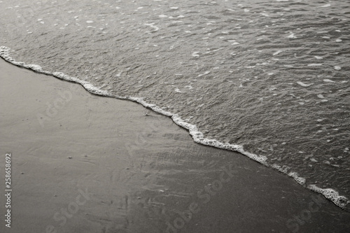 Black and white photography sand and sea.
