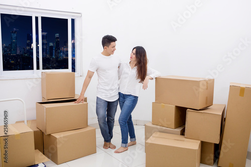 Romantic couple standing in a new apartment
