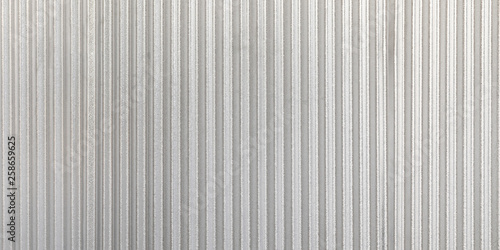 The corrugated grey metal panorama wall background. Rusty zinc grunge texture and background.