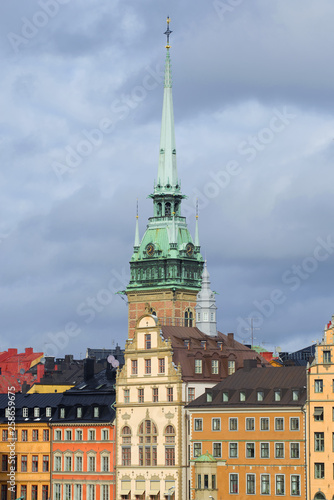 View of the spire of the old German Lutheran Church (Church of St. Gertrude) against a cloudy sky. Stockholm, Sweden