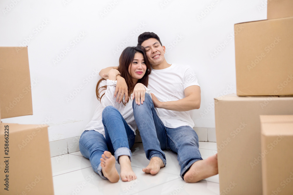 Young man embraces his wife in a new house Young man embraces his wife in a new house