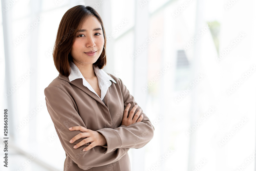 Happy business woman in an office Happy business woman in an office