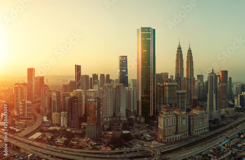 Future 3d modern neon light design skyscraper mix in sunrise Kuala Lumpur city skyline , future vision of modern city , mixed media . © jamesteohart