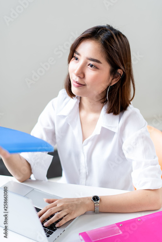 Happy business woman working in a office