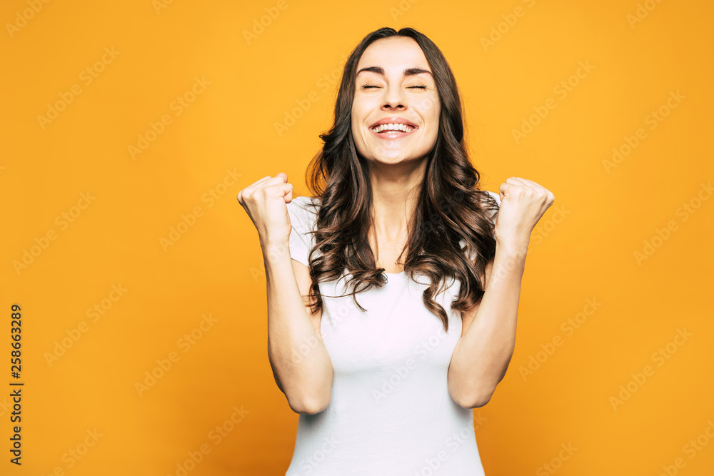 That’s exactly it! Raptured emotions of gorgeous girl with raised up hands because of happiness and closed eyes because of joy next to the background which matches her mood. That’s exactly it! Raptured emotions of gorgeous girl with raised up hands because of happiness and closed eyes because of joy next to the background which matches her mood.
